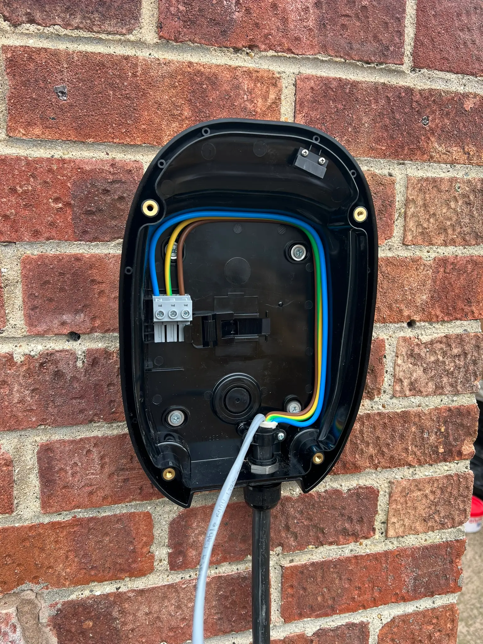 Open charger enclosure showing the wiring during installation